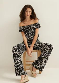 Outlet Cotton Club Off-shoulder top met tweekleurige print zwart