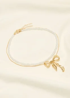 Fashion Cotton Club Parelketting met strik goud